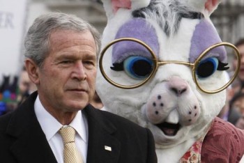 President Bush stands with a bunny character as they watch the start of the White House Easter Egg Roll, Monday, March 24, 2008, on the South Lawn at the White House in Washington. (AP Photo/Ron Edmonds)